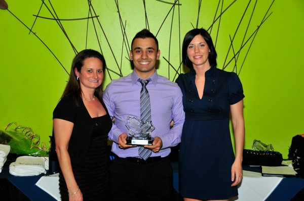 Sam posing for a year-end award