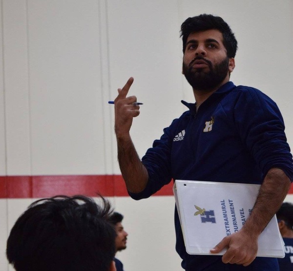 Uzair coaching the cricket players
