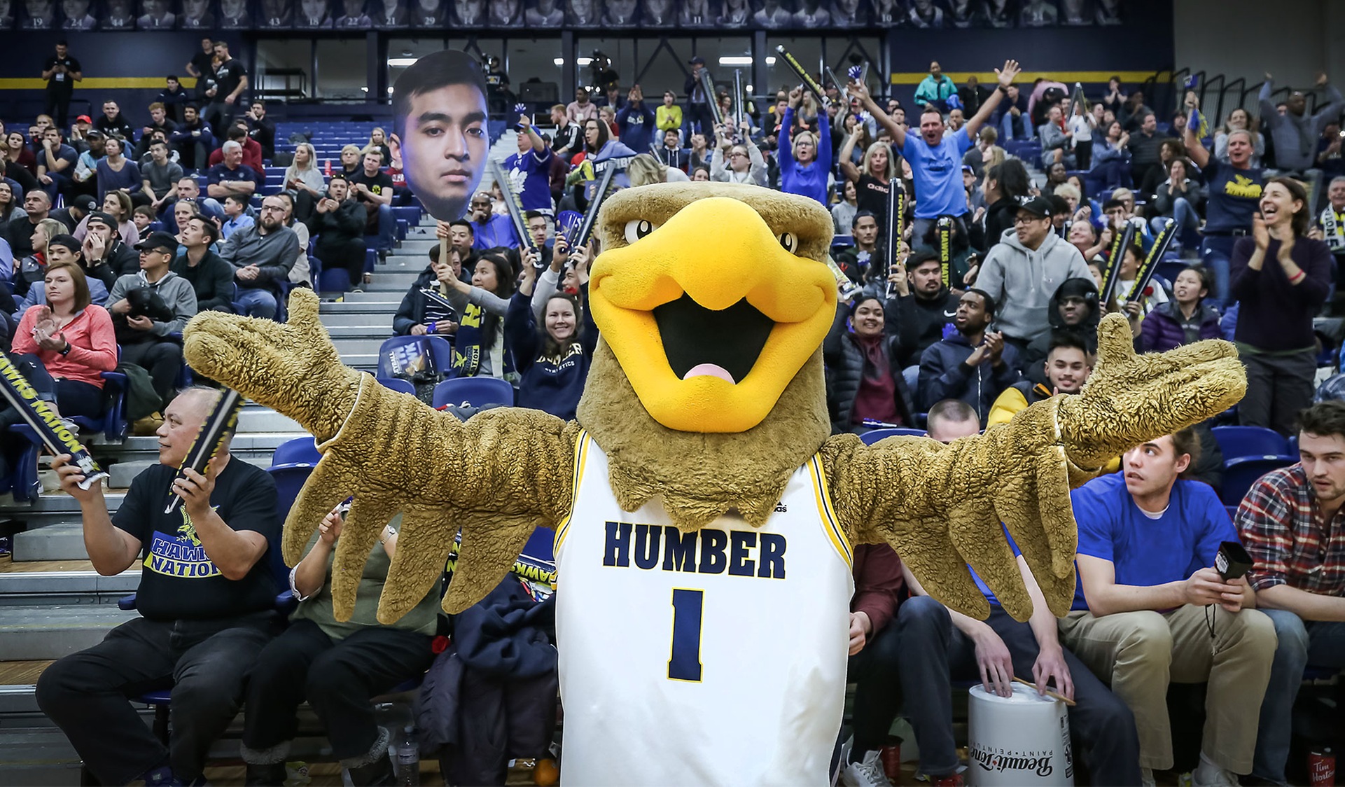 Howie the Hawk in front of the crowd