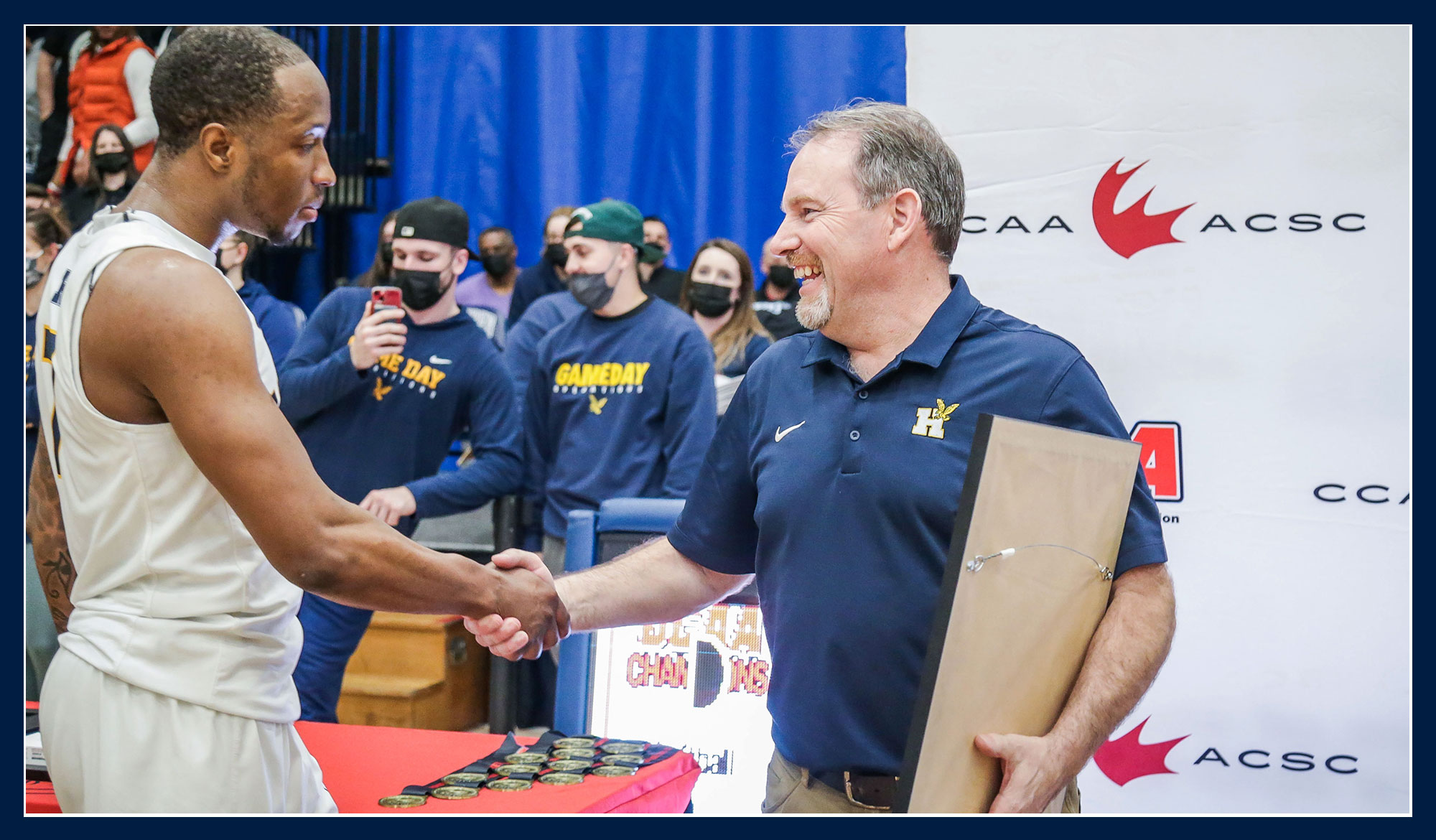 Ray Chateau shaking hands with DeQuon Cascart at nationals