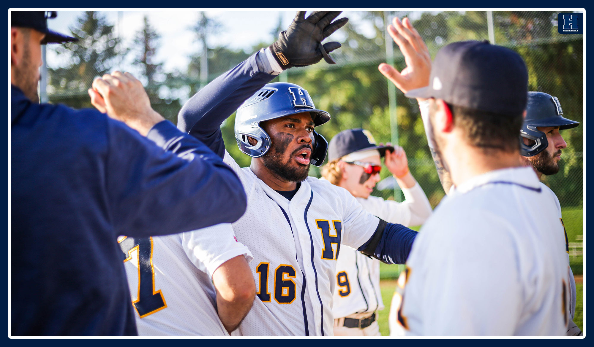 Dei Baning high fives his teammates after a home run