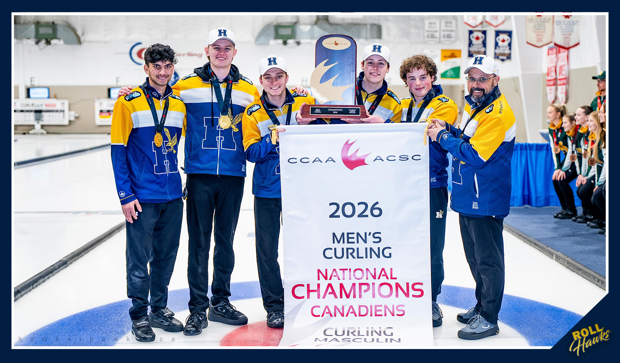 Humber curling holding the CCAA banner and trophy