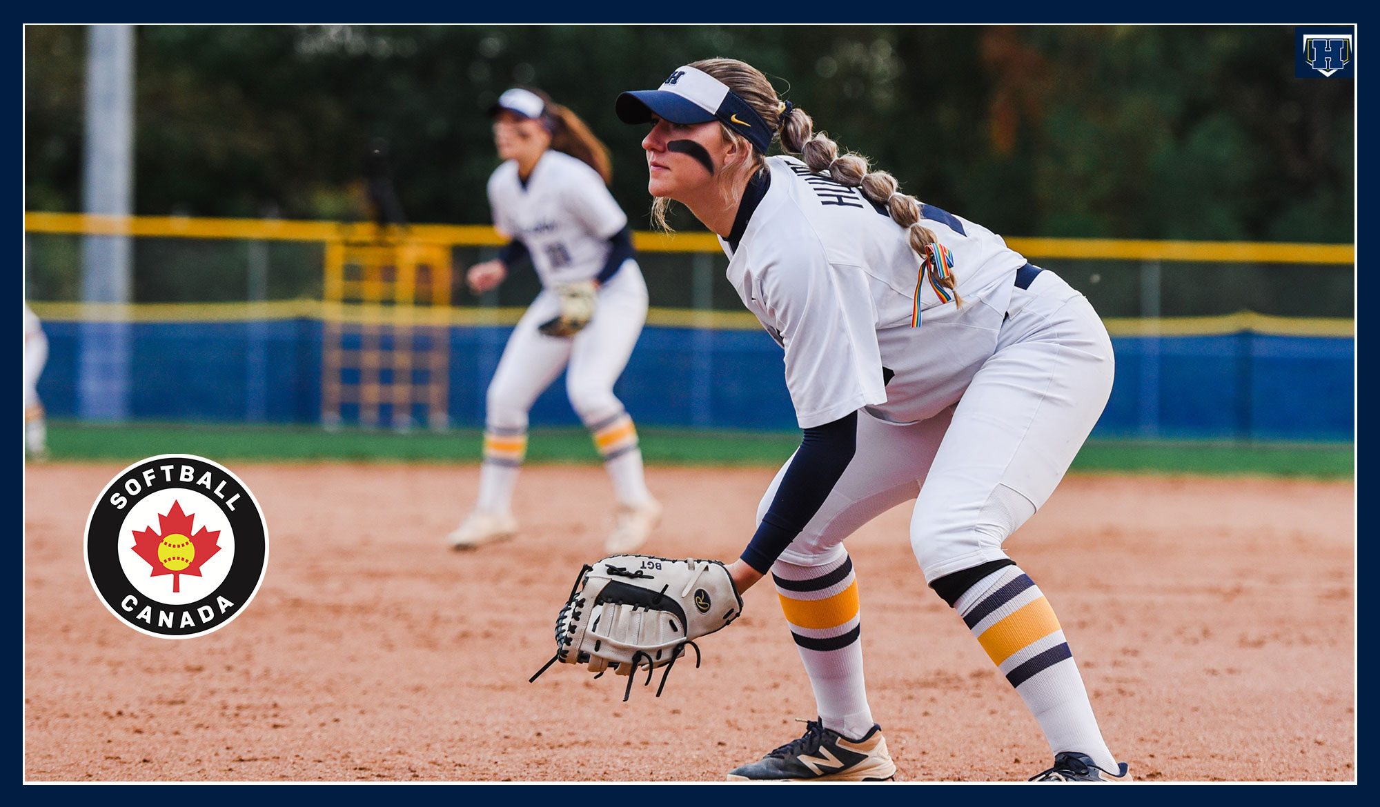 Hayley Pasma playing defence with the softball Canada logo
