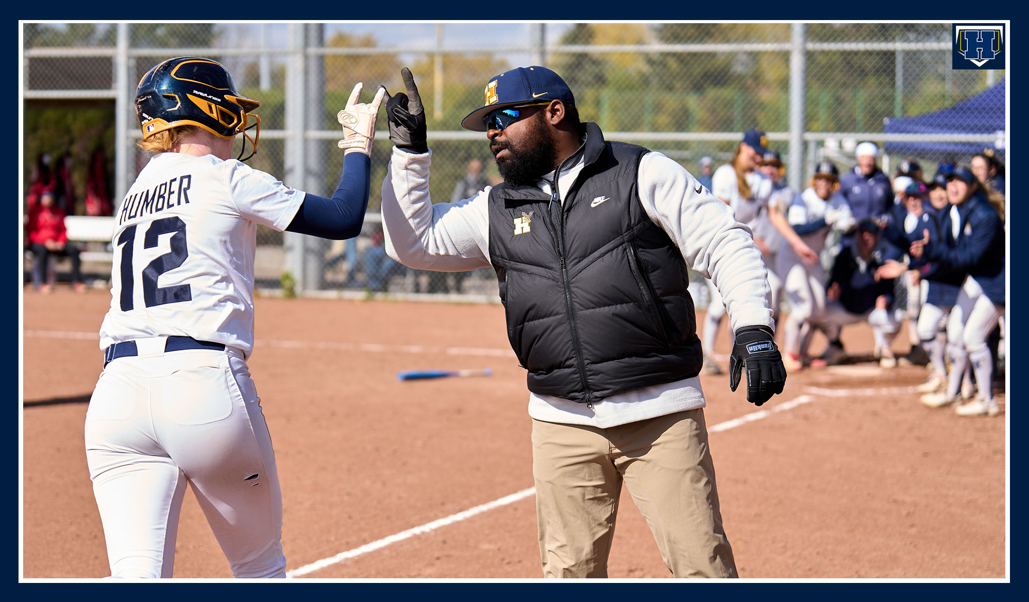 Hannah celebrating a home run
