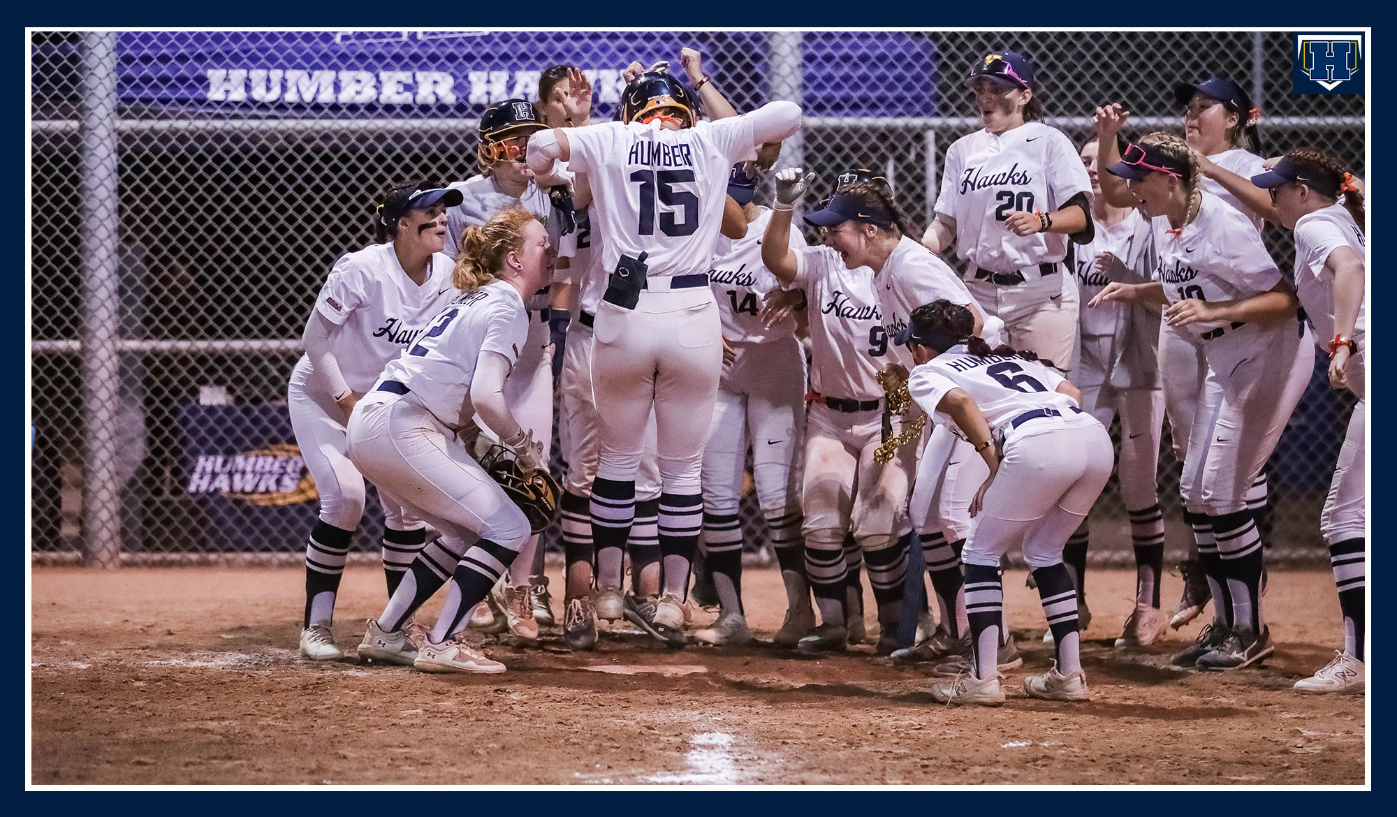 Rilee touching home as her teammates celebrate