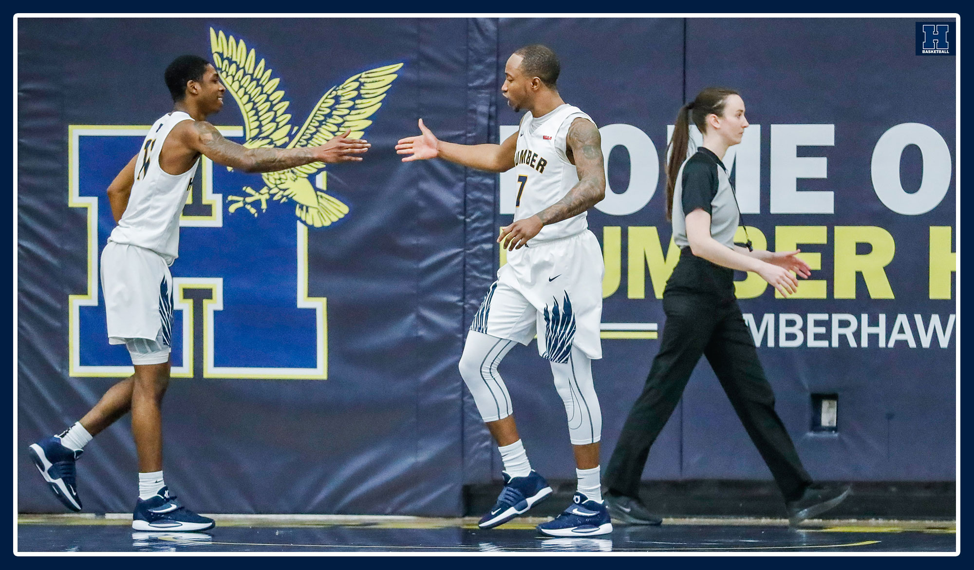 DeQuon Cascart and Kevin Otoo high-fiving