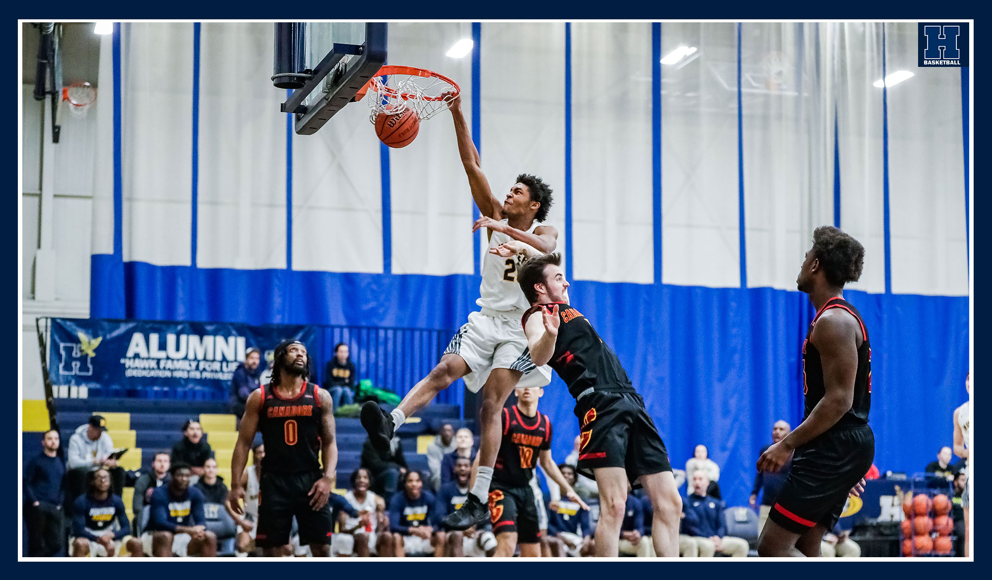 Motiki-Stephens dunking on a defender