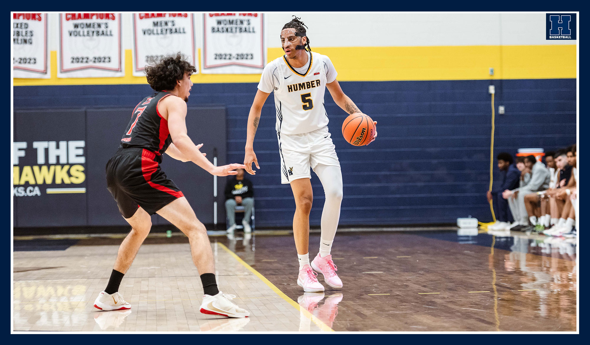 Malik Grant bringing the ball up court against Fanshawe