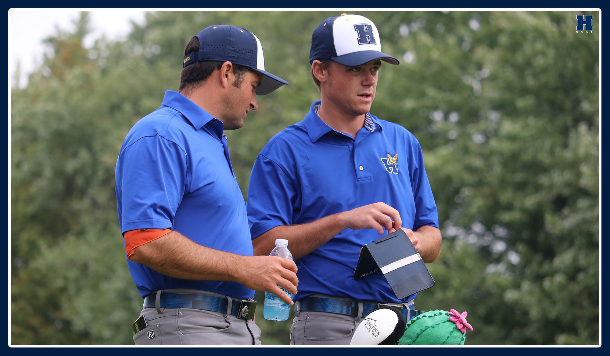 Golf coach going over shot options with a player
