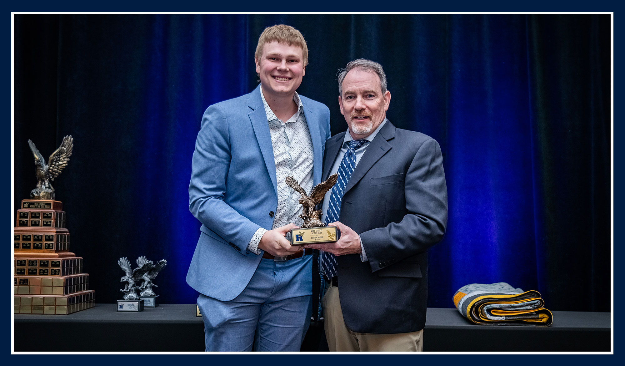 Matthew receiving his award from Ray Chateau