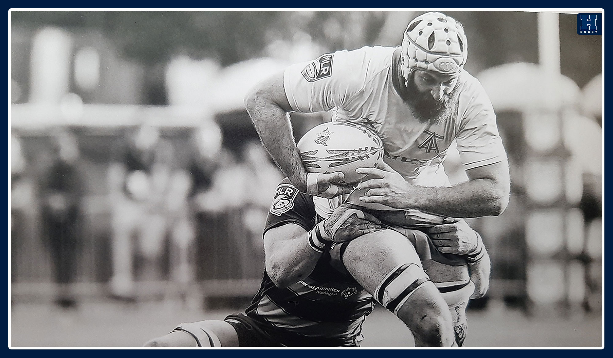 Michael Sheppard getting tackled in a rugby match