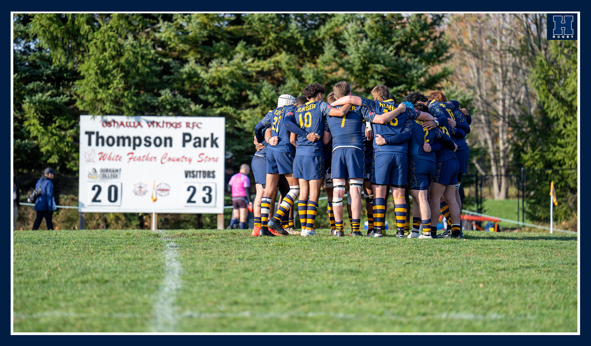 Men's rugby huddled after the win