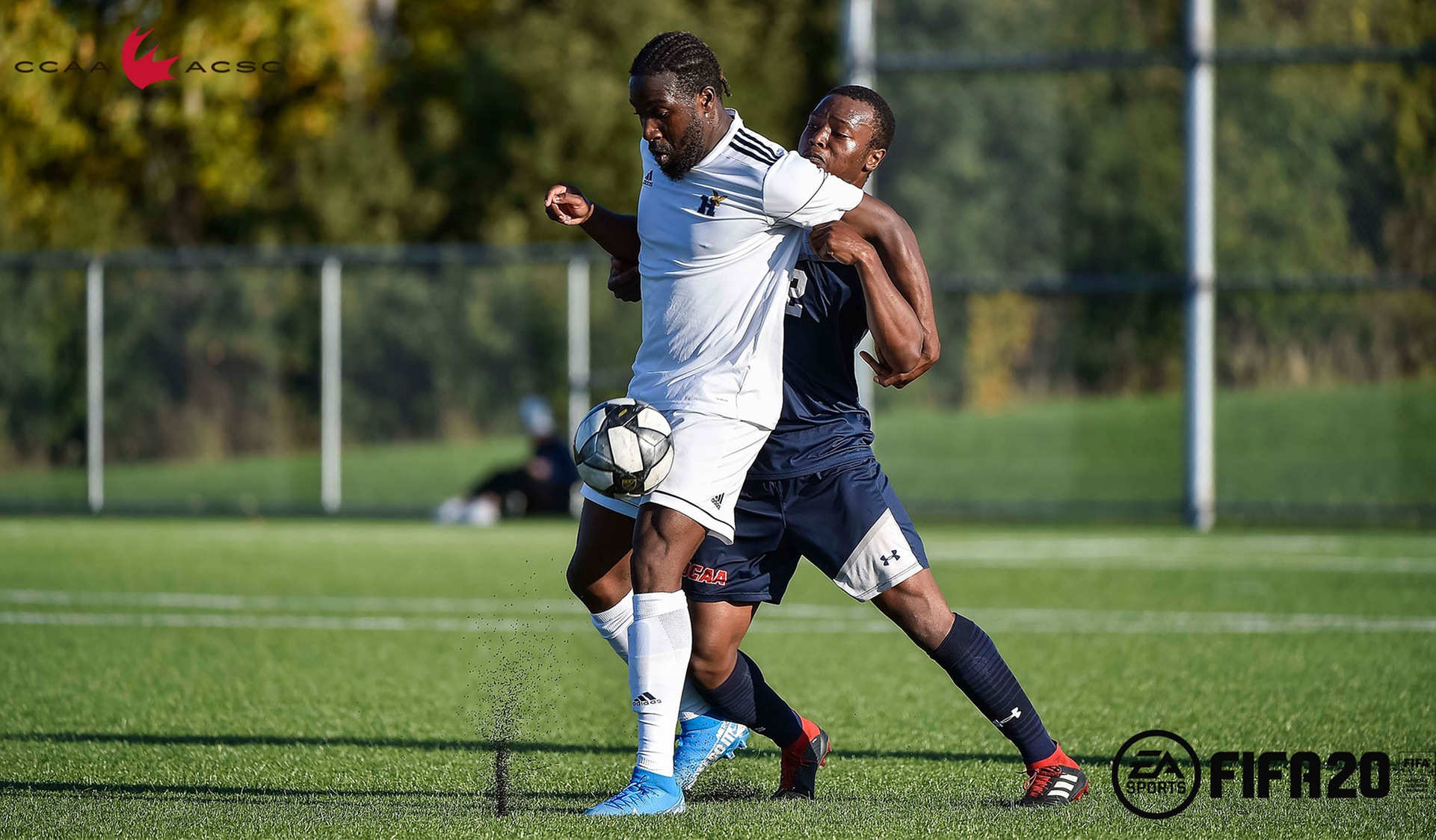 Leaford Allen making a play on the ball against a UTM defender. 