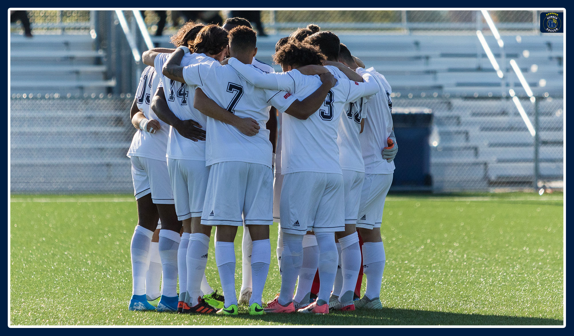 Men's soccer squad huddled up before the match begins