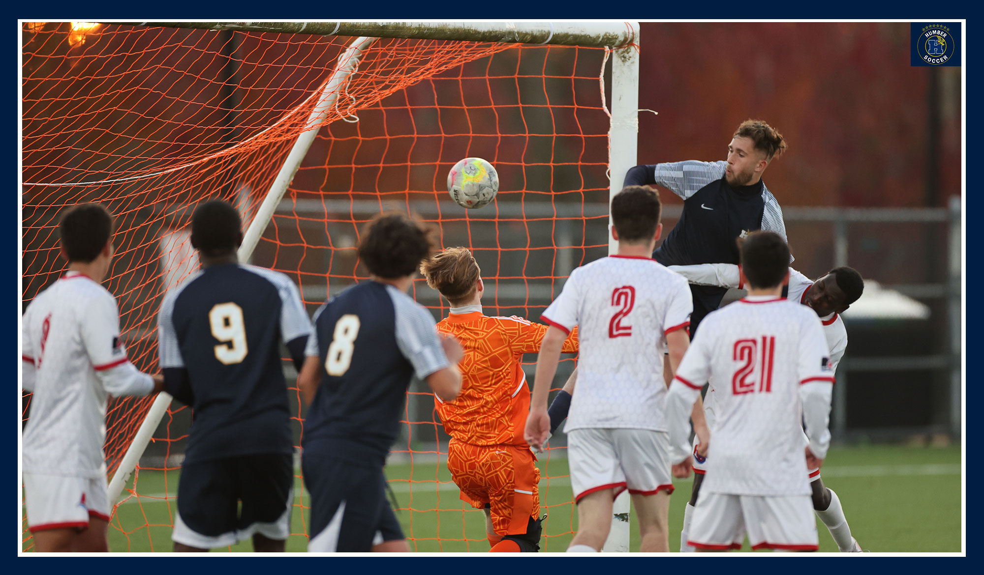 Alex Meczarski scoring on a corner kick