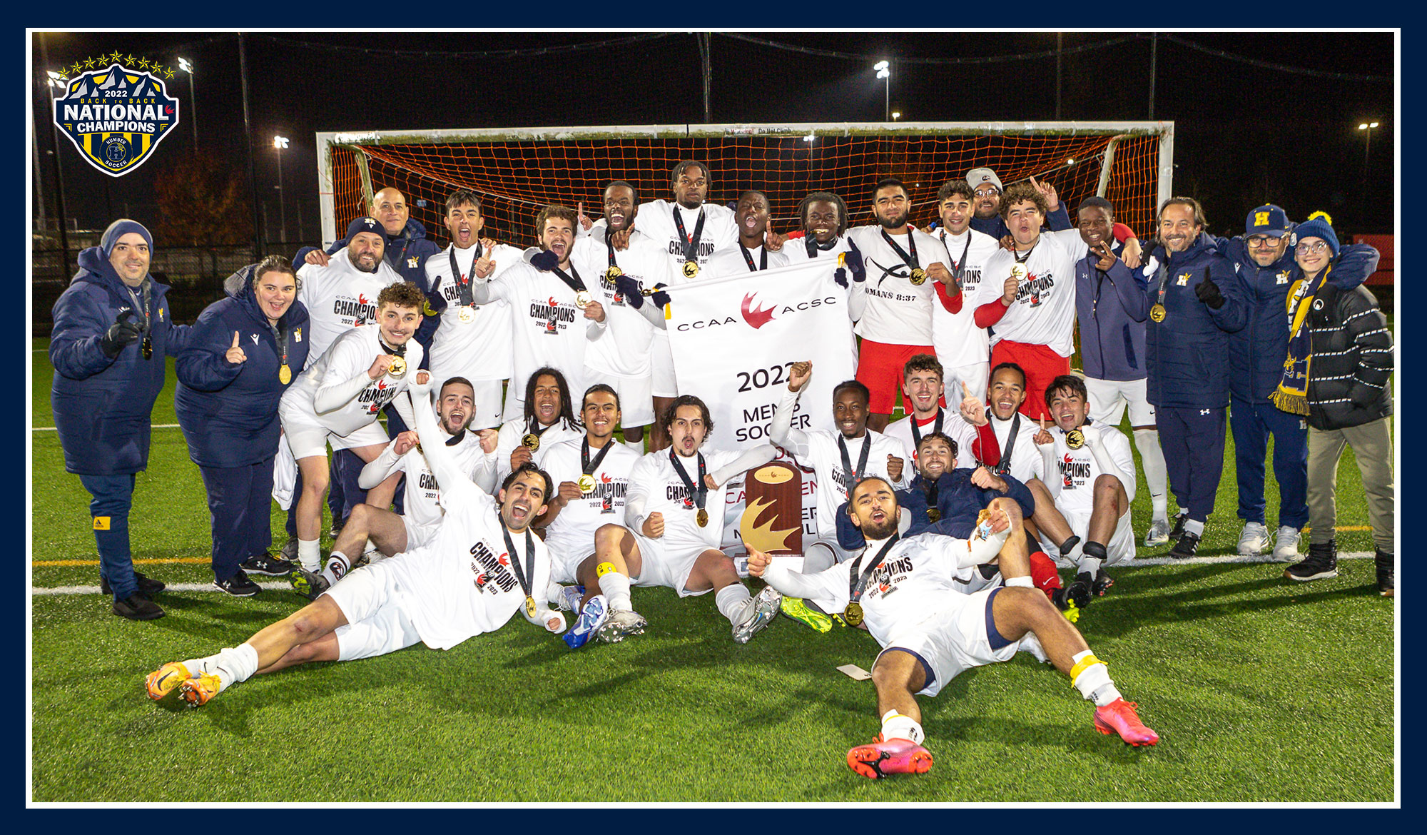 Men's soccer team photo with national championship banner