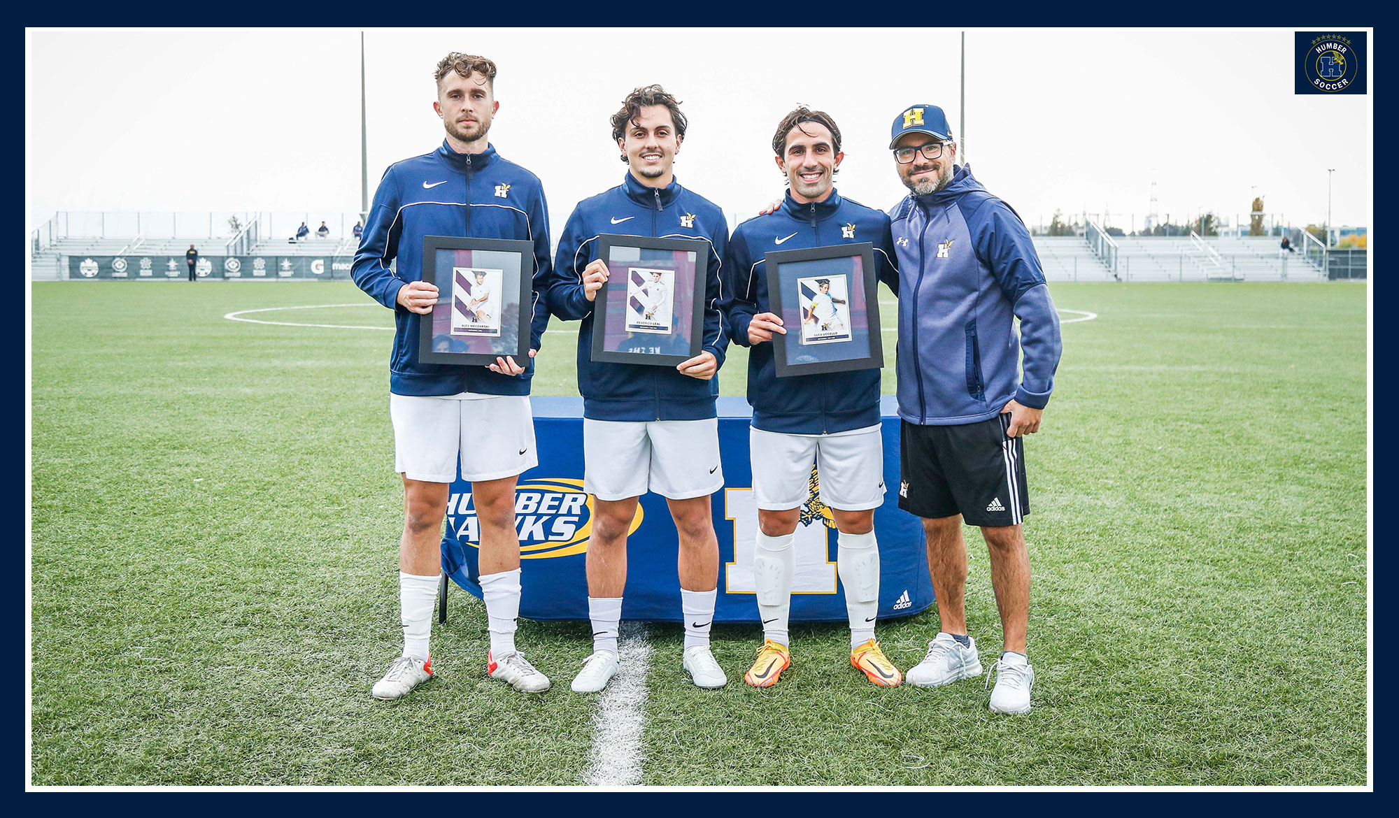 Men's soccer seniors posing with their frames
