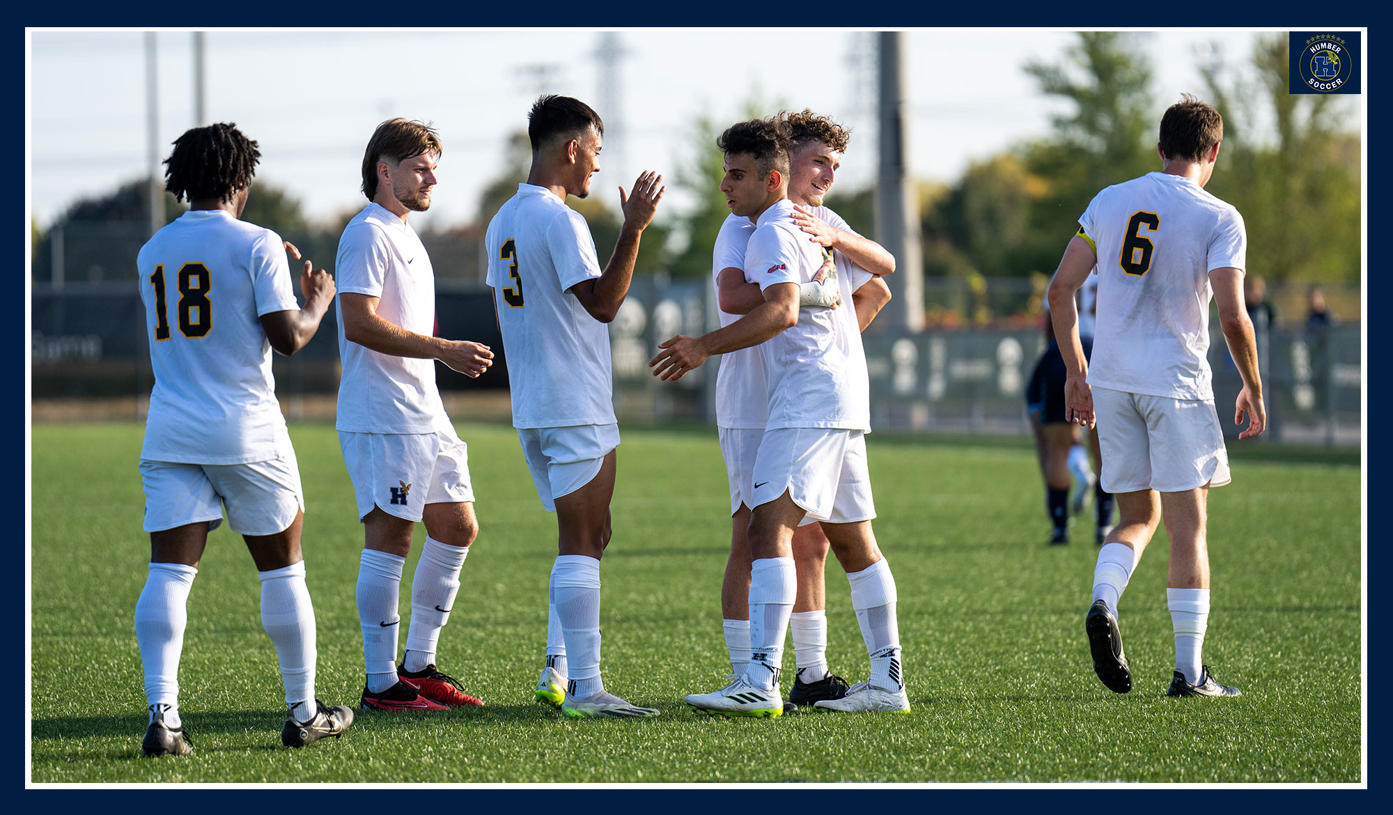 Men's soccer celebrating a goal