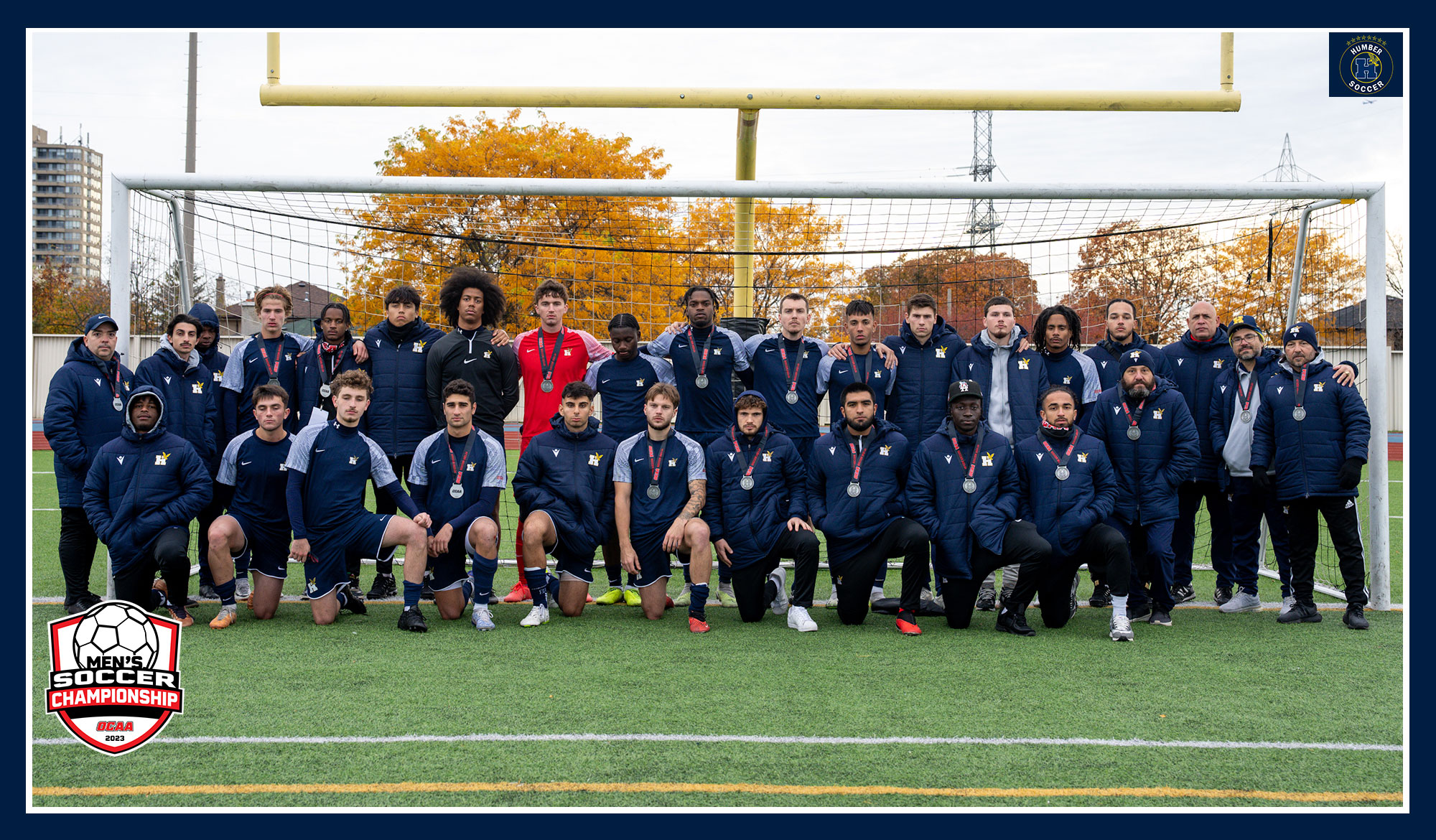 Men's soccer team photo with silver medal