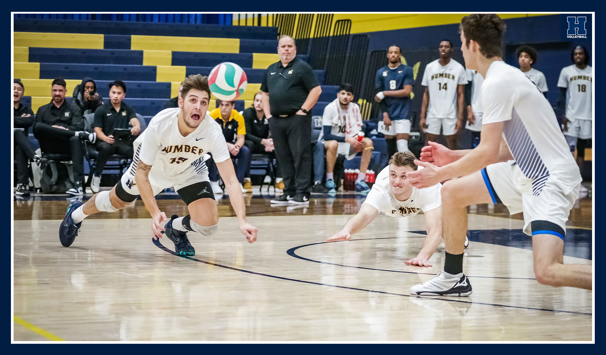 Gomes and Medes diving for the ball