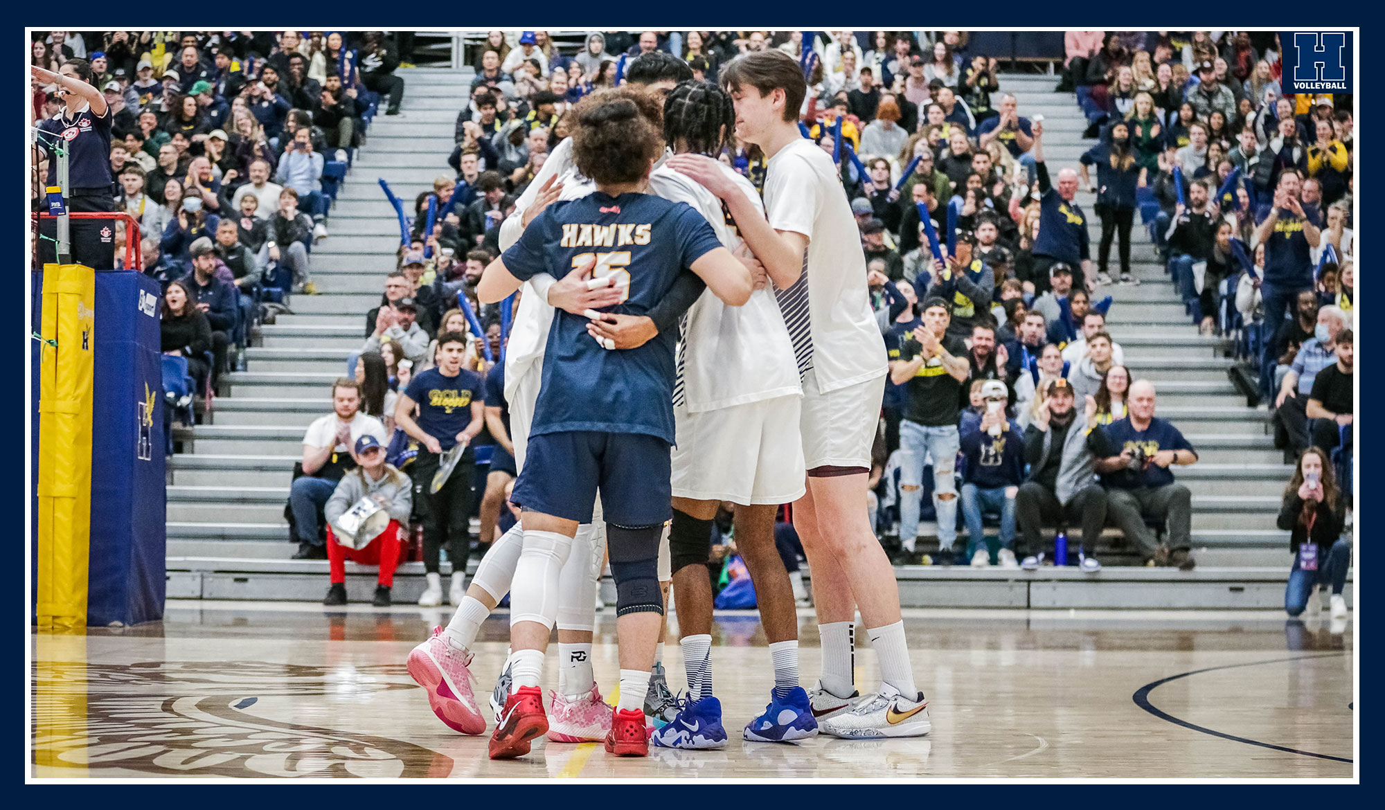 Men's volleyball celebrating a point