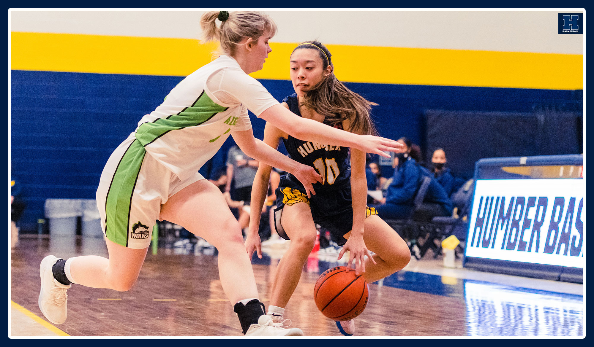 Nikki Ylagan crossing over an Algonquin defender