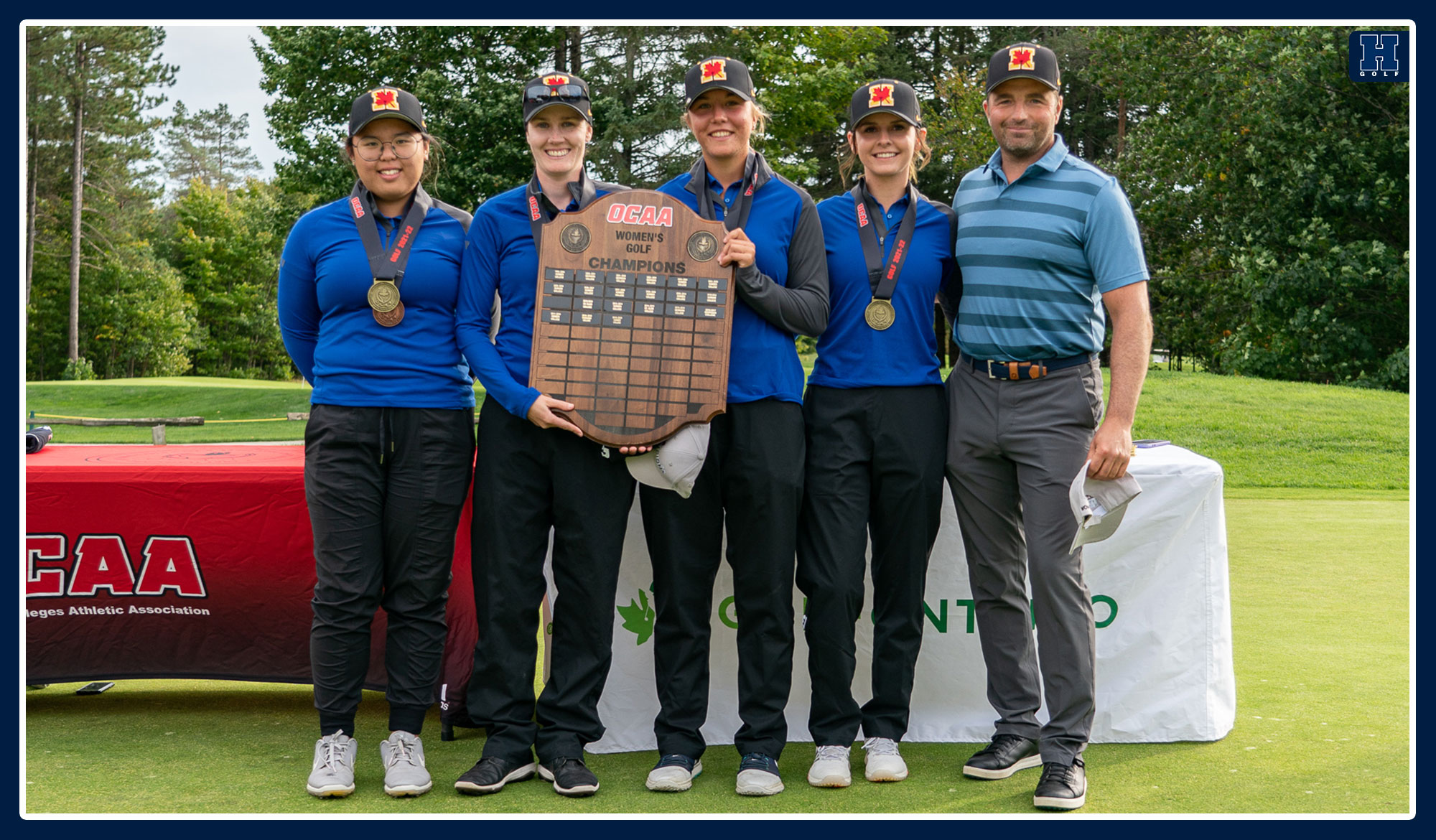 Women's golf holding up the provincial championship plaque