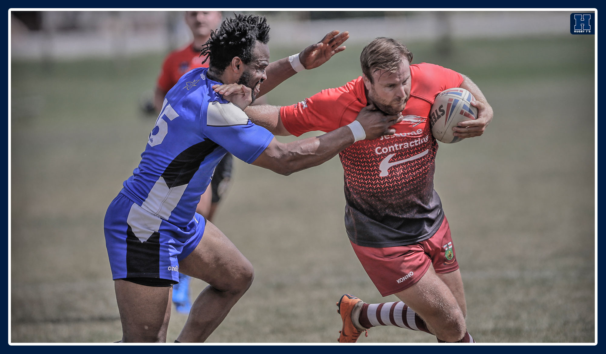 Scott Christian  throwing a stiff arm in a rugby match