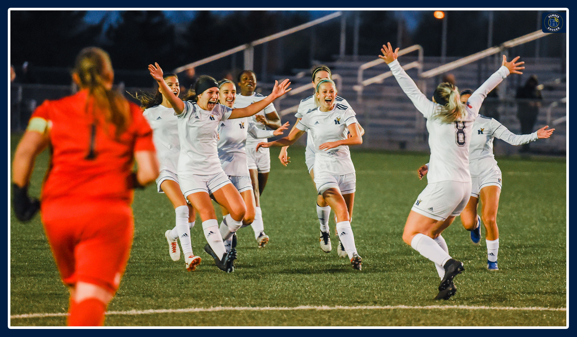 Women's soccer celebrate winning in penalty kicks