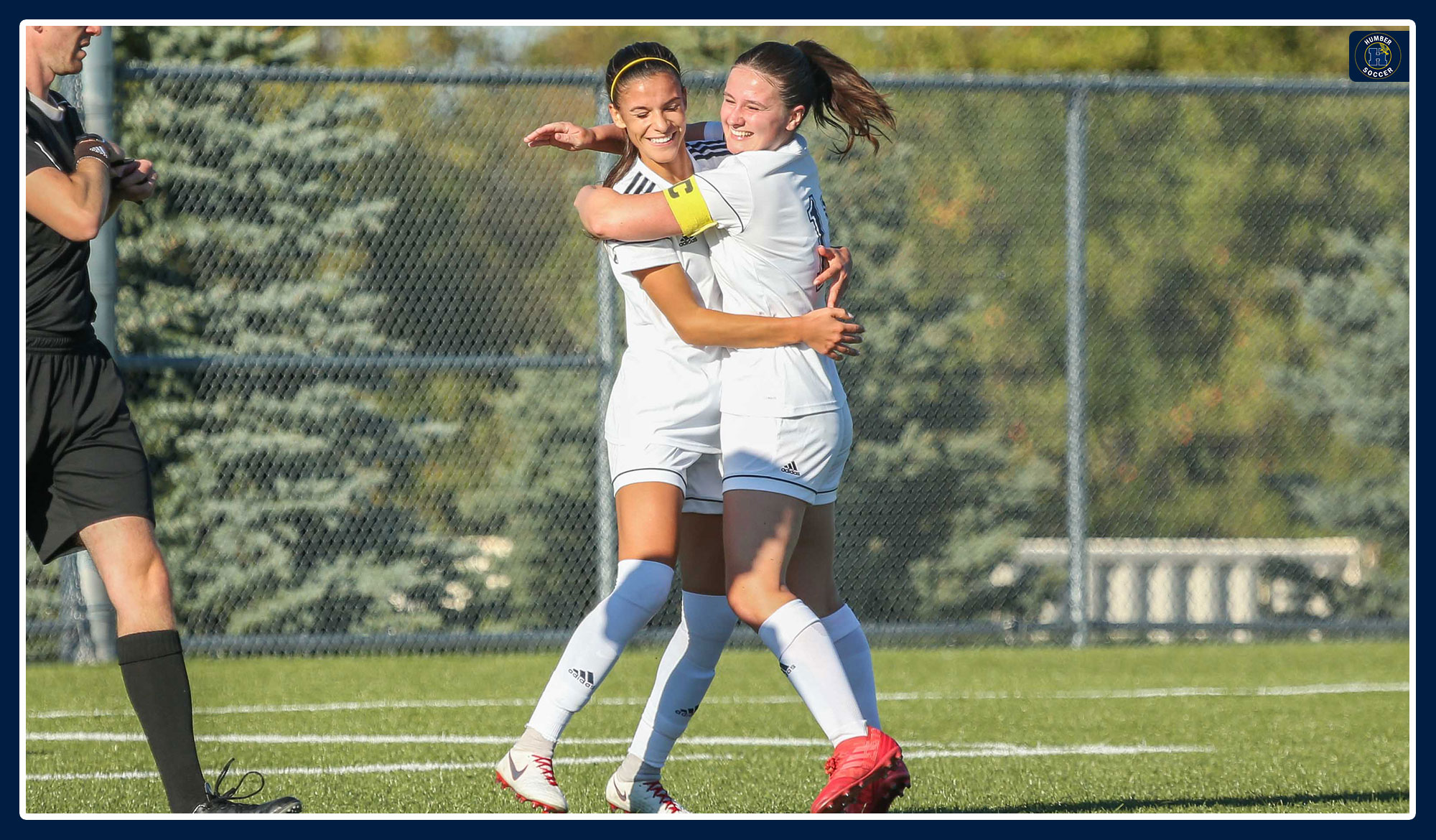 Spratt and Russell embrace after a goal