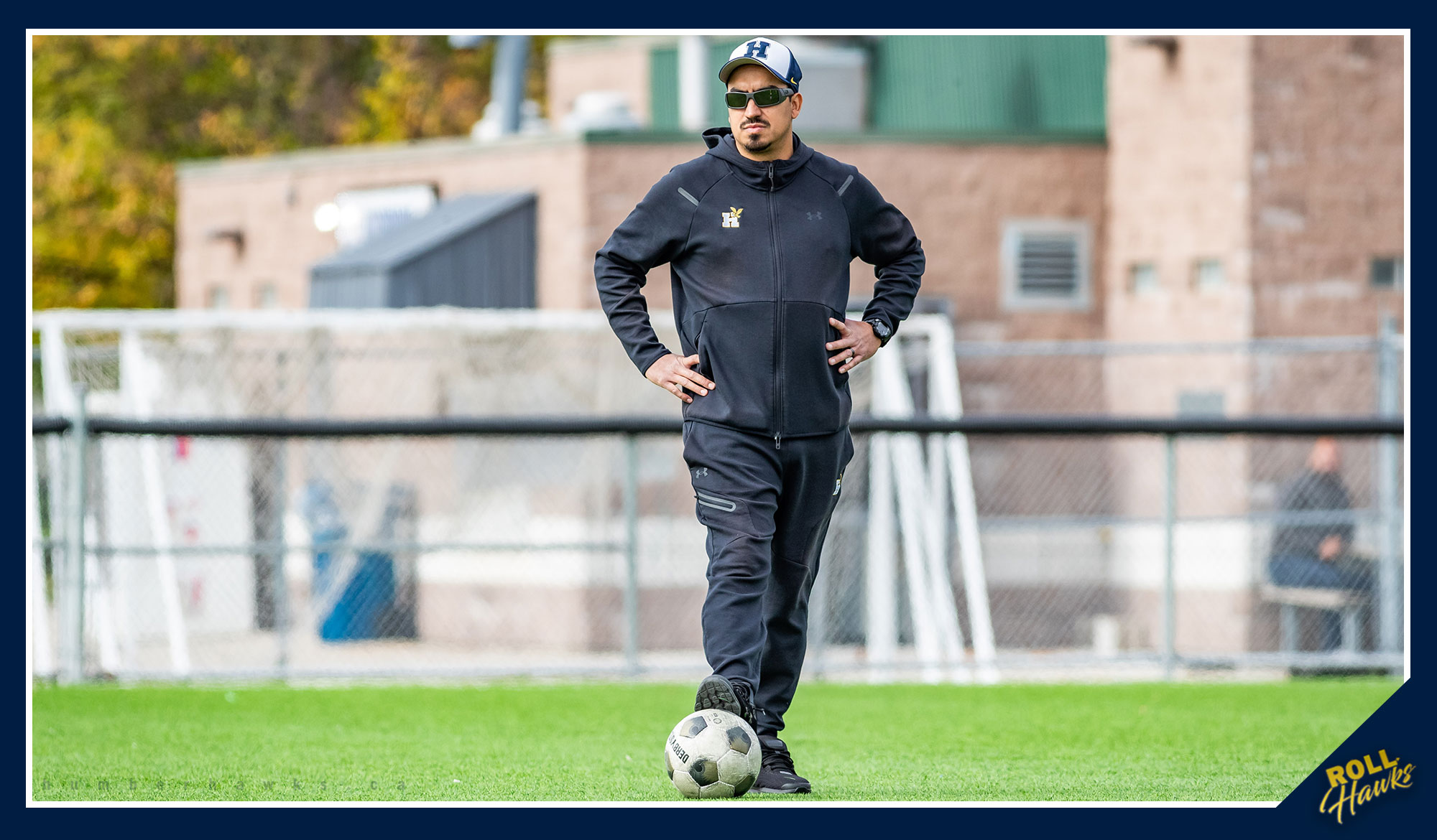 Marcelo standing over a soccer ball with his hands on his hips