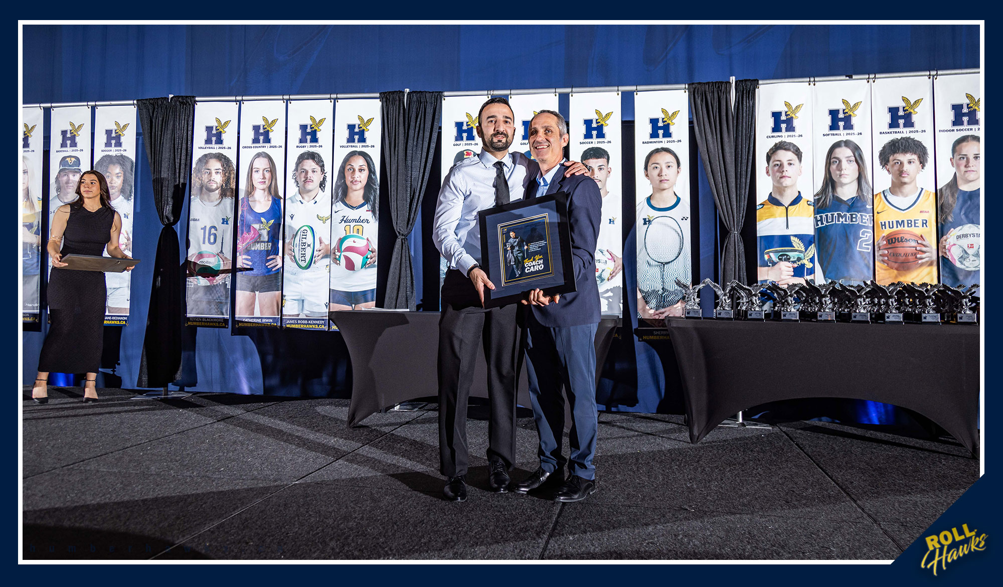 Coach Caro receiving a frame for his retirement