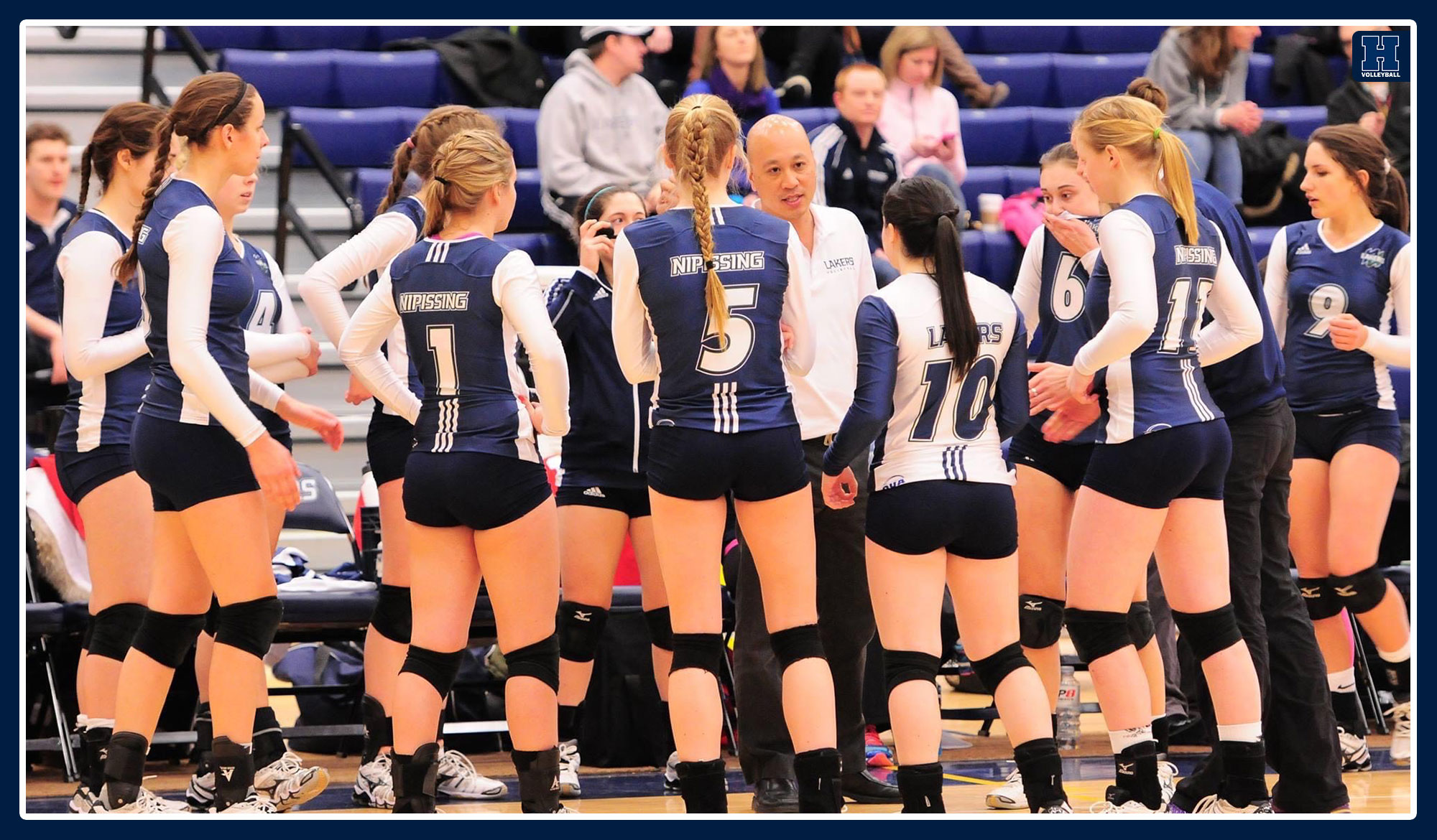 Coach Hong discussing a game plan with his team.