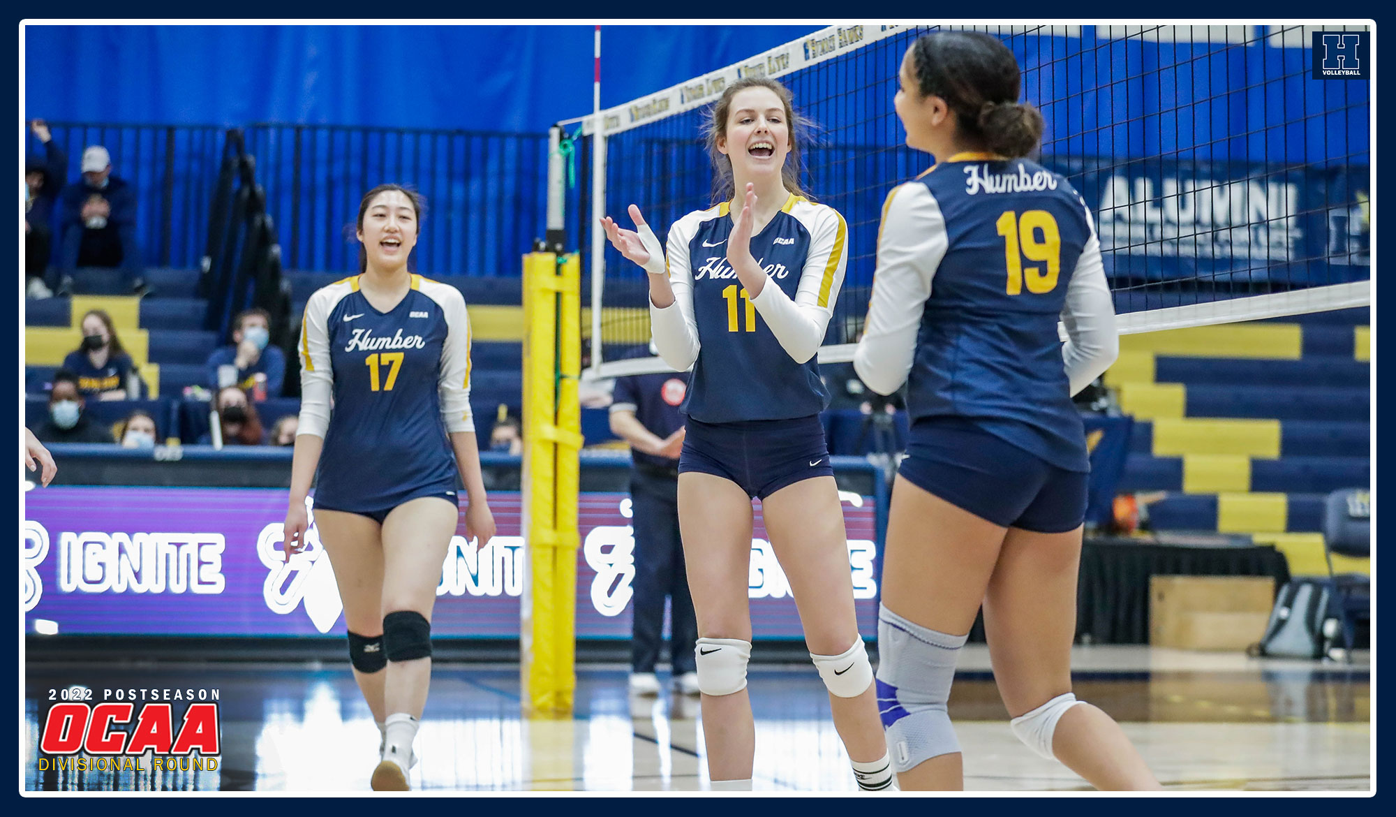 Women's volleyball celebrating a point