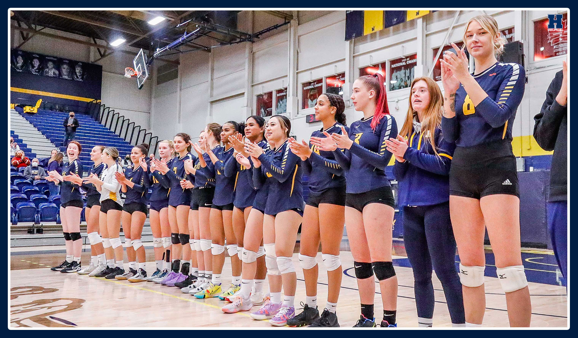 Women's volleyball lining up for the national anthem