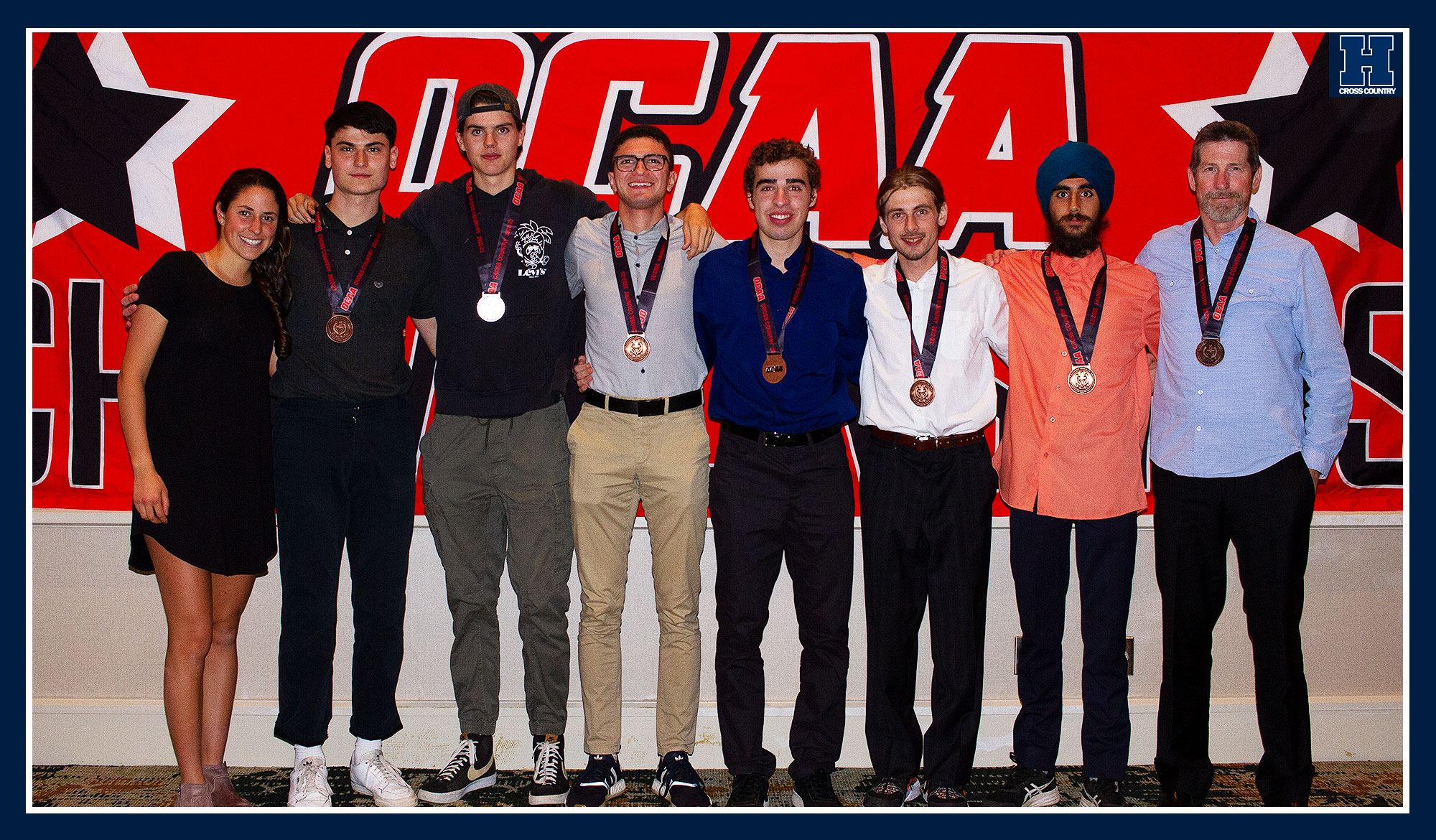 Men's cross country posing with their bronze medals